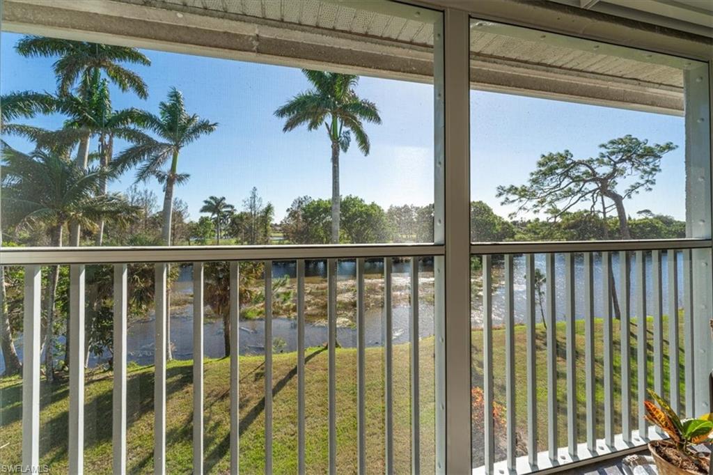 5515 Rattlesnake Hamm Road, Unit 301 Naples, FL 34113 - Photo 14 of 30 a view of balcony with wooden floor