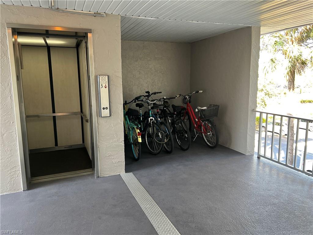 5515 Rattlesnake Hamm Road, Unit 301 Naples, FL 34113 - Photo 22 of 30 a view of a livingroom with furniture and a window