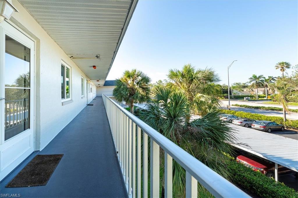 5515 Rattlesnake Hamm Road, Unit 301 Naples, FL 34113 - Photo 24 of 30 a view of a balcony