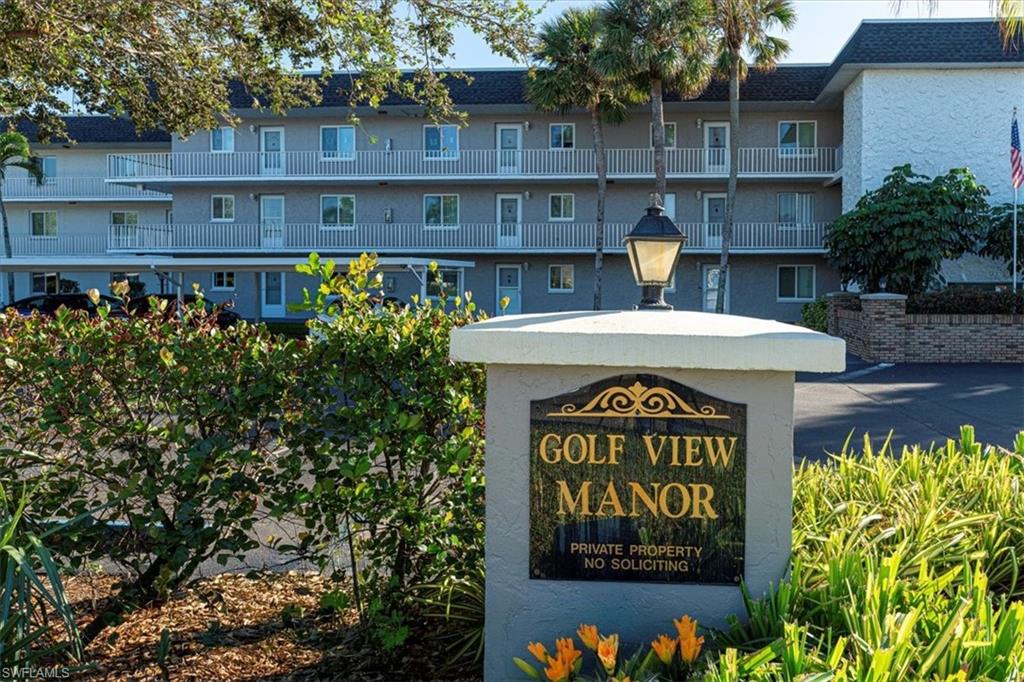 5515 Rattlesnake Hamm Road, Unit 301 Naples, FL 34113 - Photo 27 of 30 a sign on the side of a building