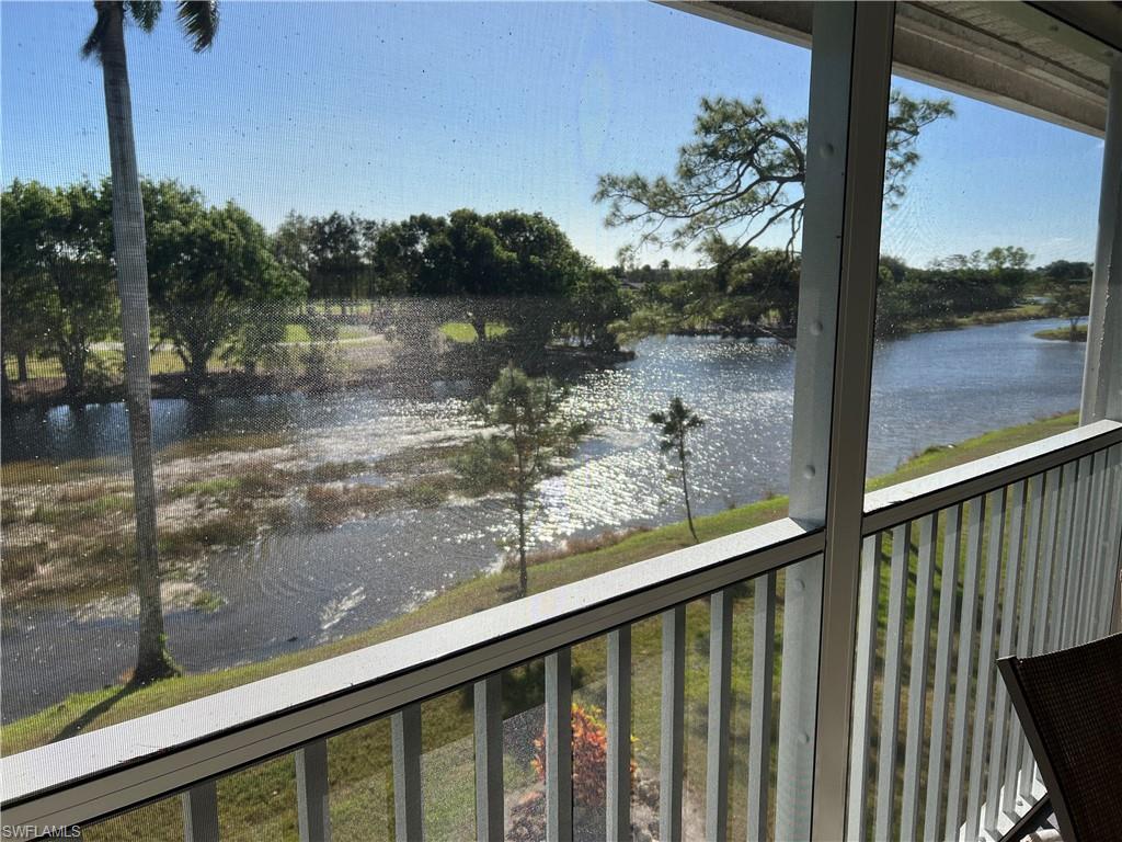 5515 Rattlesnake Hamm Road, Unit 301 Naples, FL 34113 - Photo 3 of 30 a view of a lake from a balcony