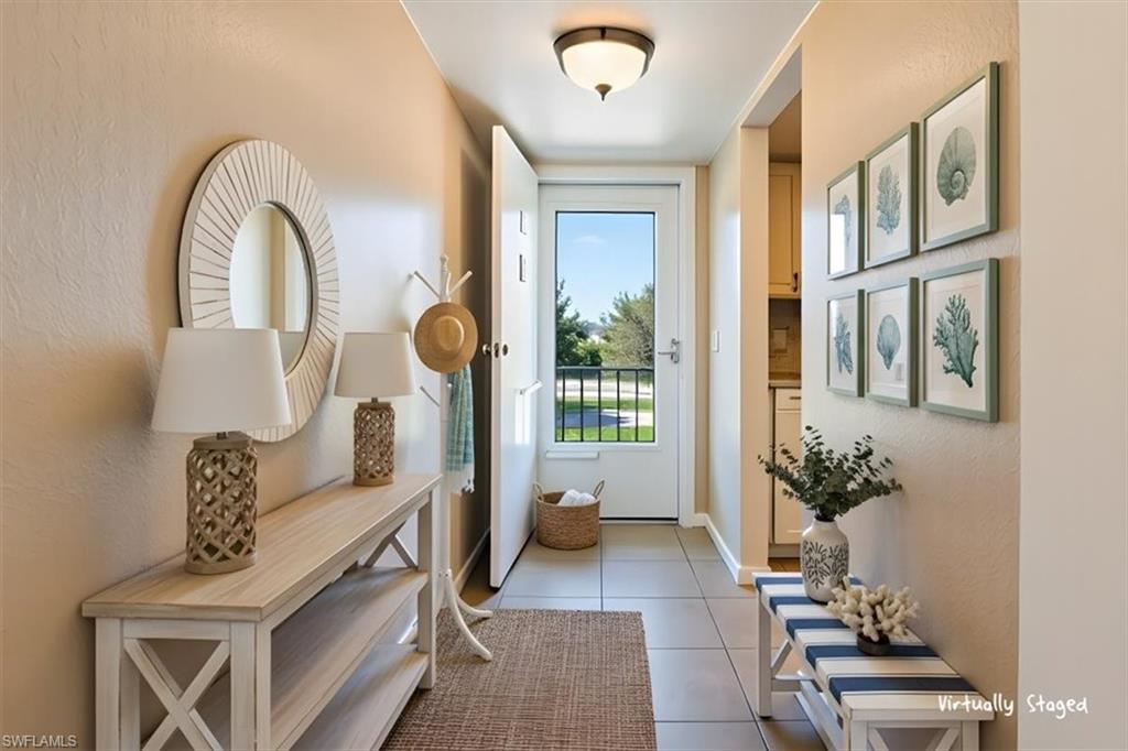 5515 Rattlesnake Hamm Road, Unit 301 Naples, FL 34113 - Photo 5 of 30 a view of living room filled with furniture and windows