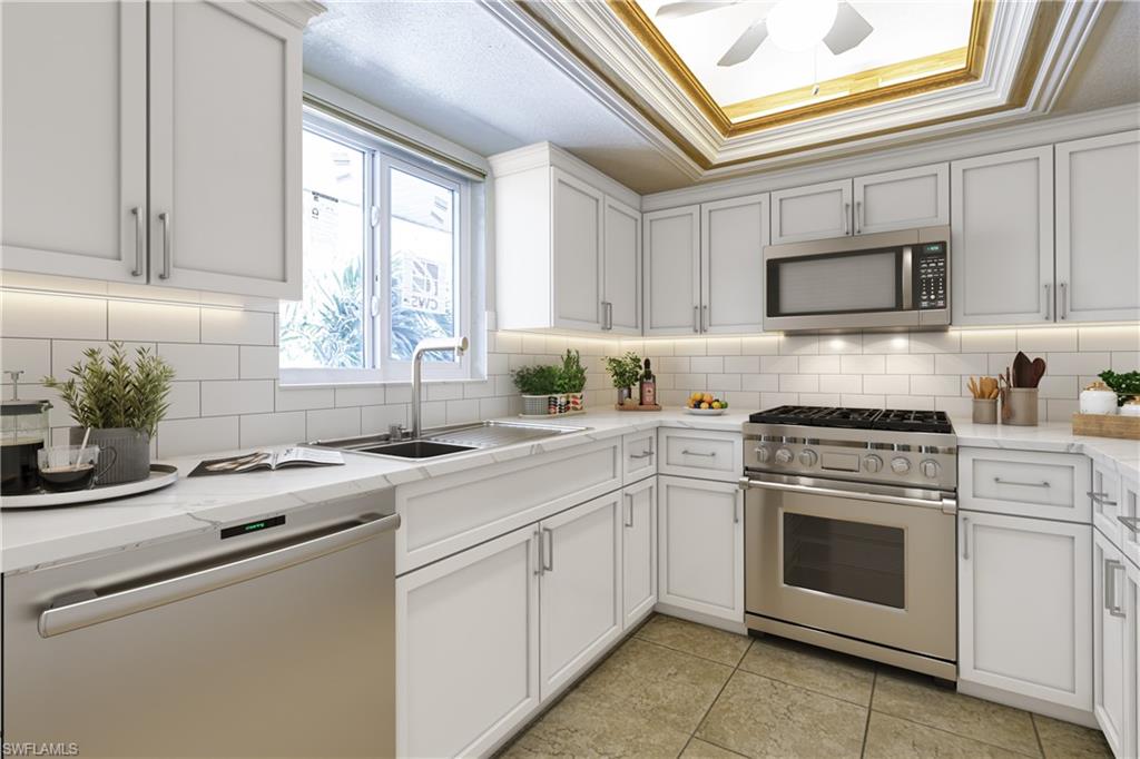 5515 Rattlesnake Hamm Road, Unit 301 Naples, FL 34113 - Photo 7 of 30 a kitchen with cabinets stainless steel appliances a sink and a window