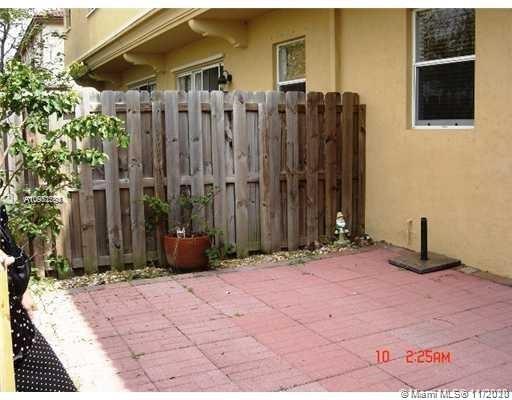 12813 Southwest 132nd Terrace Miami, FL 33186 - Photo 2 of 8 a front view of a house with a yard