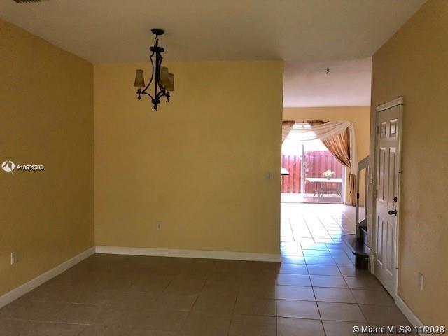 12813 Southwest 132nd Terrace Miami, FL 33186 - Photo 5 of 8 a view of a hallway with a room
