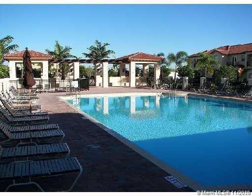 12813 Southwest 132nd Terrace Miami, FL 33186 - Photo 7 of 8 a view of a swimming pool with a patio