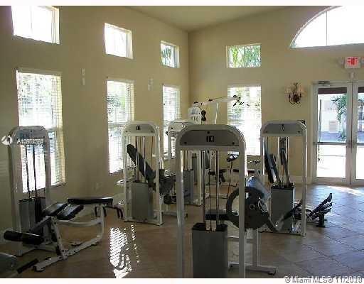 12813 Southwest 132nd Terrace Miami, FL 33186 - Photo 8 of 8 a view of a room with gym equipment