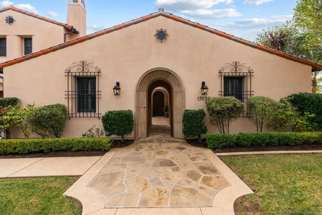 a view of a dining room with furniture wooden floor and chandelier