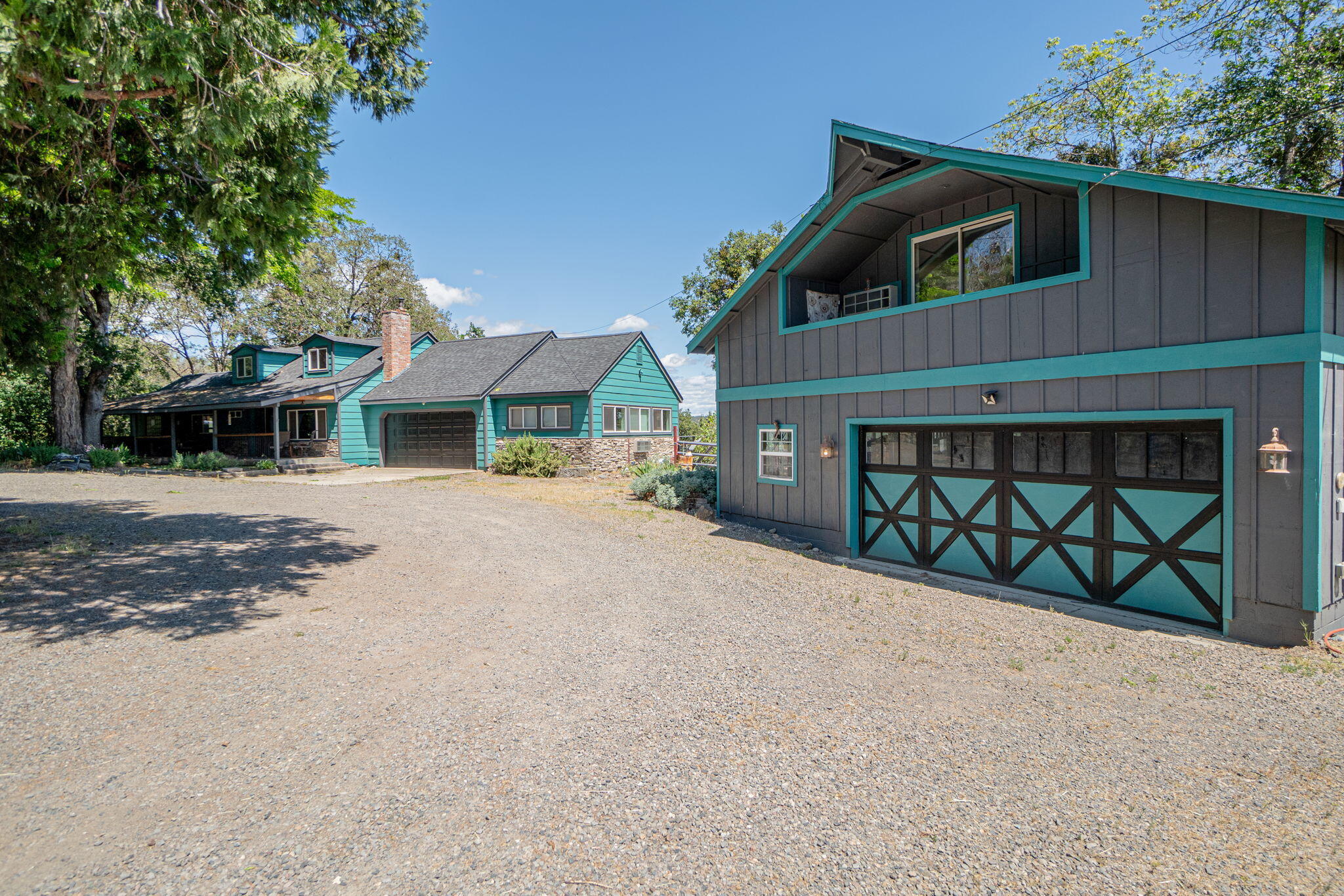 a view of a house with a yard and garage