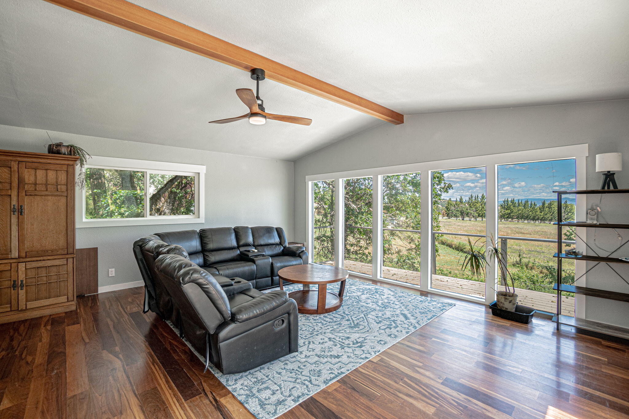 4970 Old Stage Road Central Point, OR 97502 - Photo 11 of 43 a living room with furniture and a large window with wooden floor