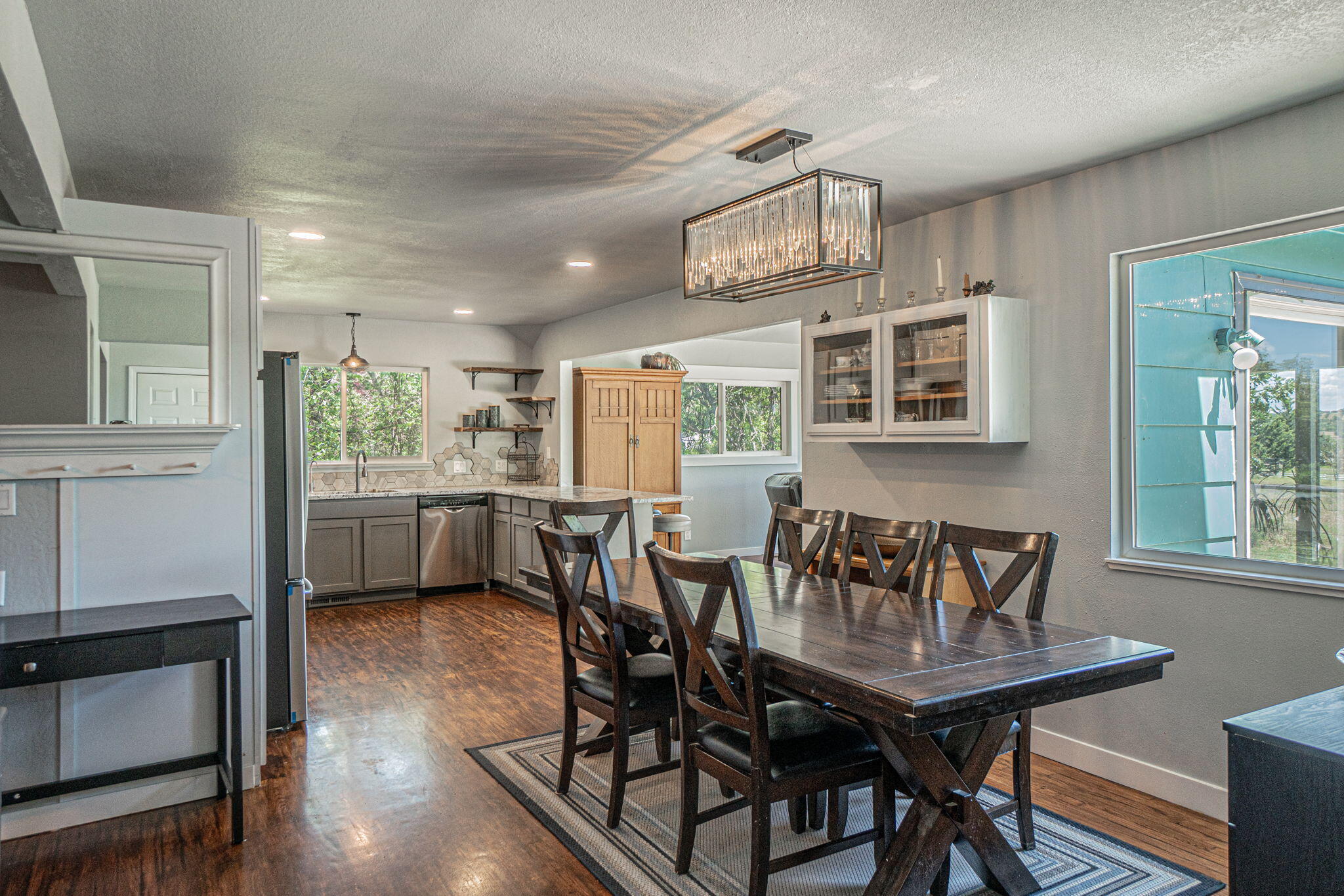 4970 Old Stage Road Central Point, OR 97502 - Photo 13 of 43 a view of a dining room with furniture and wooden floor