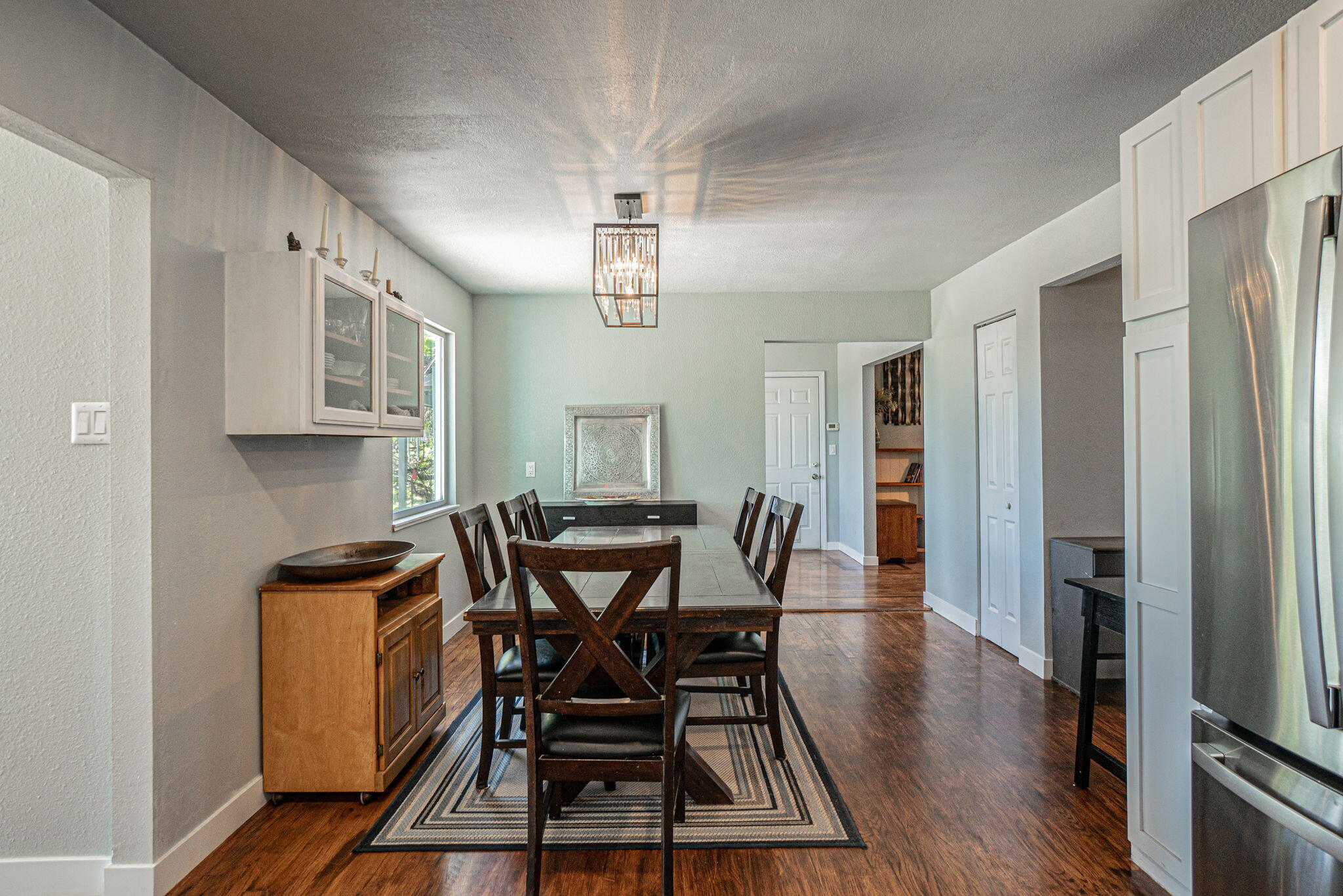4970 Old Stage Road Central Point, OR 97502 - Photo 14 of 43 a view of a dining room with furniture and wooden floor