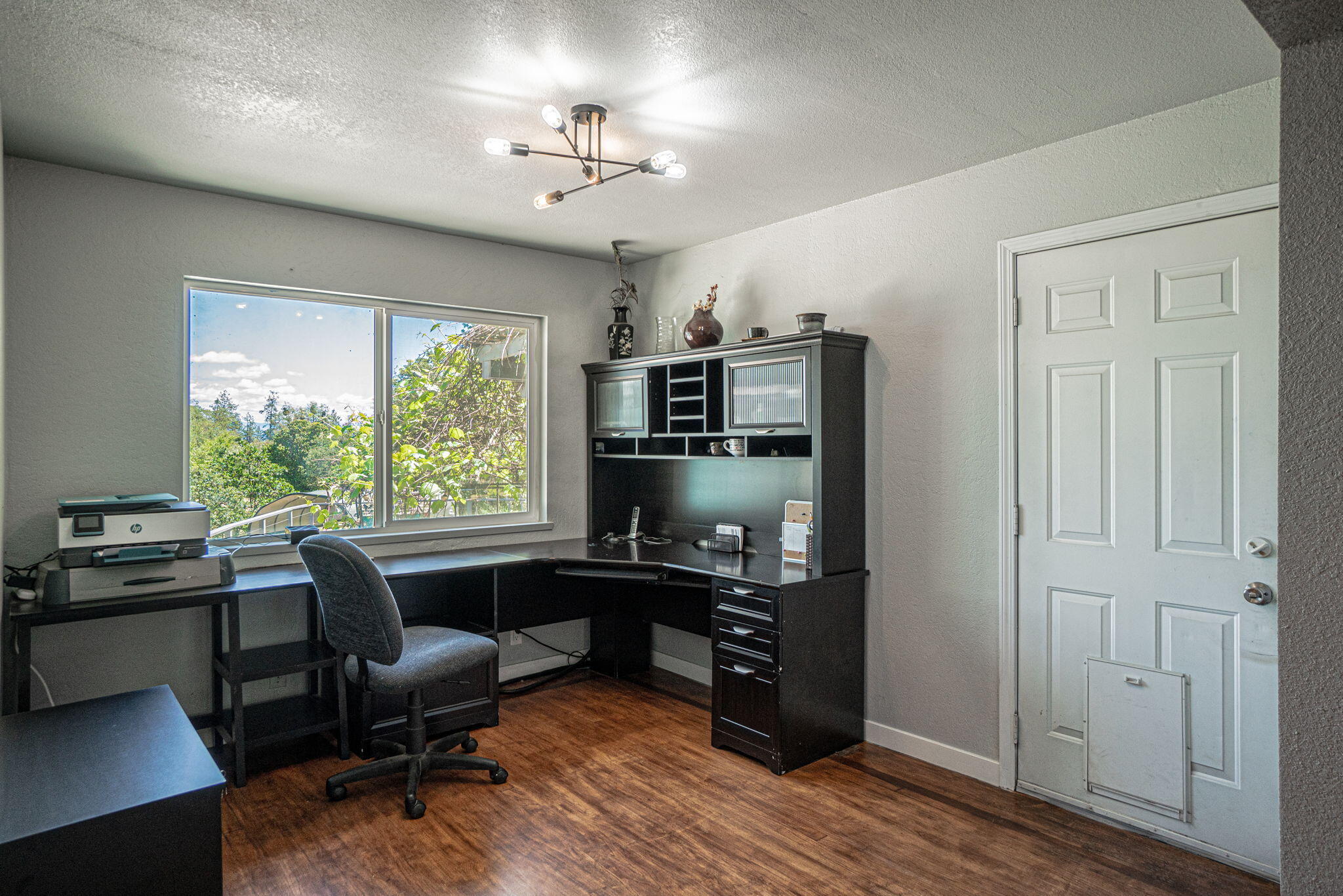 4970 Old Stage Road Central Point, OR 97502 - Photo 15 of 43 a view of a workspace with furniture and a window