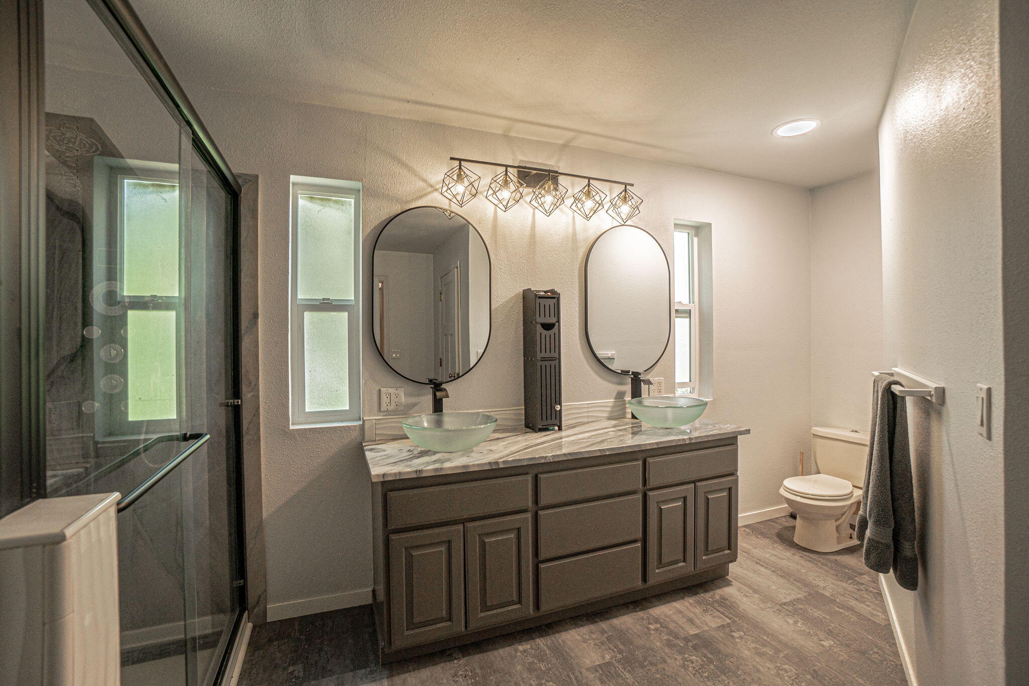 4970 Old Stage Road Central Point, OR 97502 - Photo 18 of 43 a bathroom with a double vanity sink and a mirror