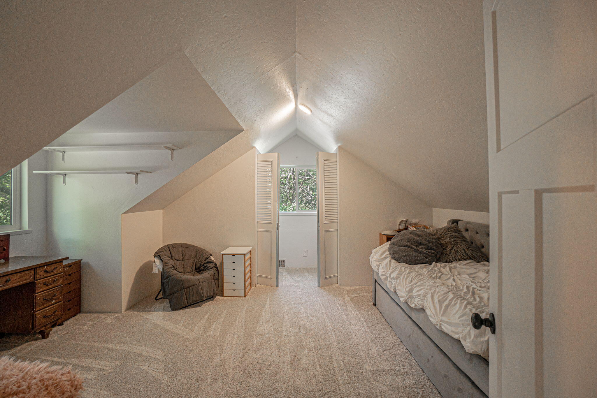 4970 Old Stage Road Central Point, OR 97502 - Photo 23 of 43 a bedroom with a bed and closet with wooden floor