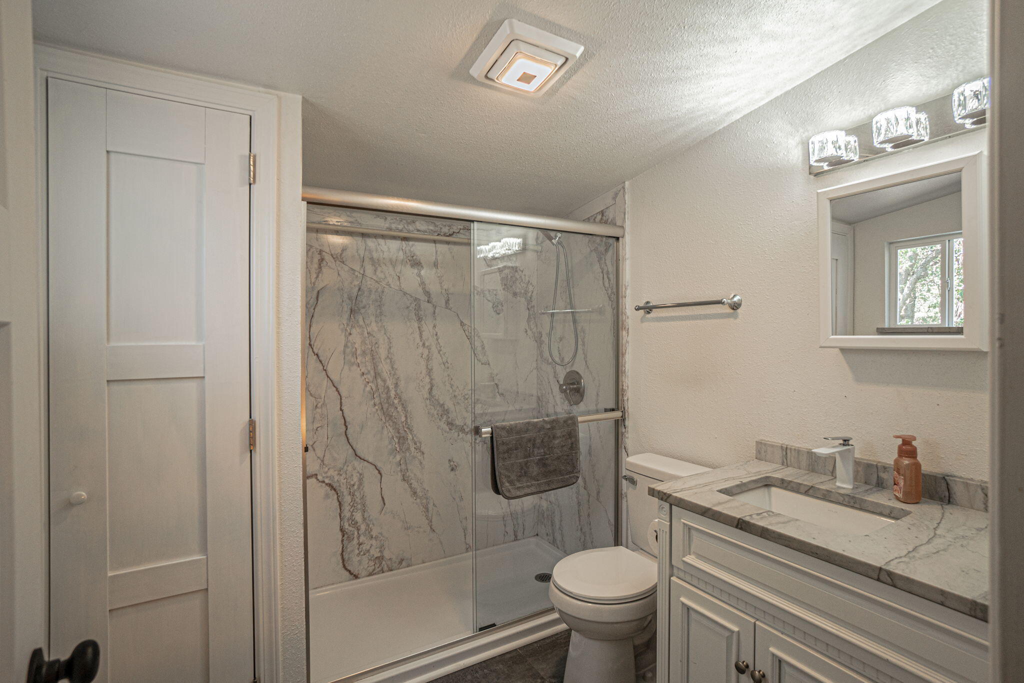 4970 Old Stage Road Central Point, OR 97502 - Photo 26 of 43 a bathroom with a granite countertop sink toilet and shower