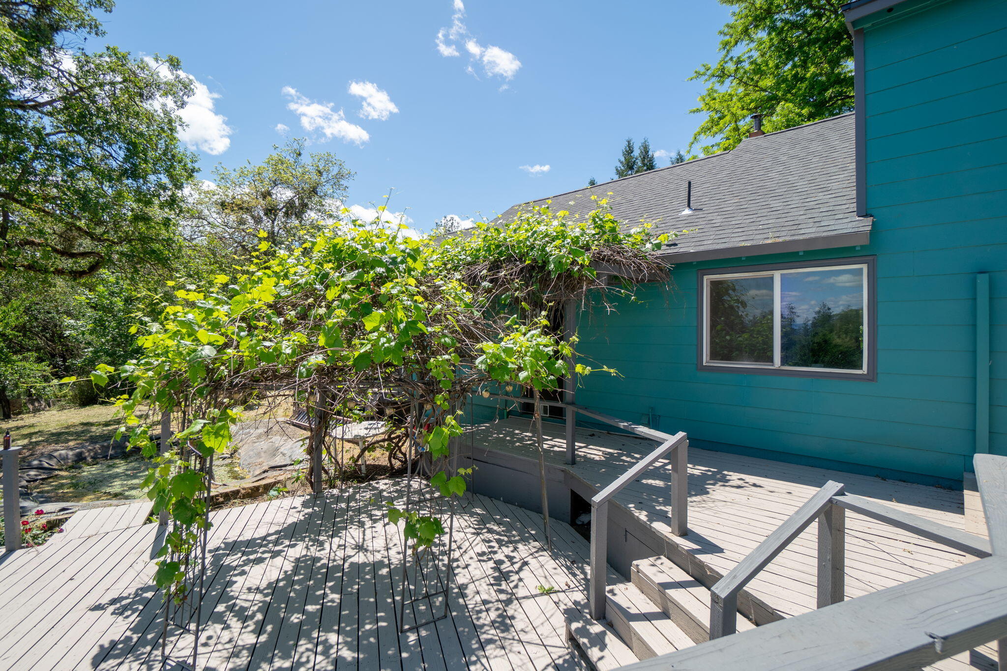 4970 Old Stage Road Central Point, OR 97502 - Photo 28 of 43 a backyard of a house with table and chairs