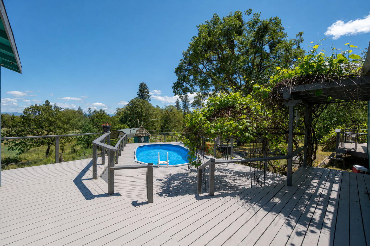 4970 Old Stage Road Central Point, OR 97502 - Photo 29 of 43 a view of a wooden deck and a patio