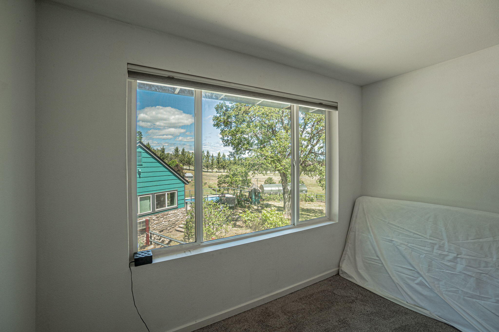 4970 Old Stage Road Central Point, OR 97502 - Photo 35 of 43 a view of a room that has a bed and a window