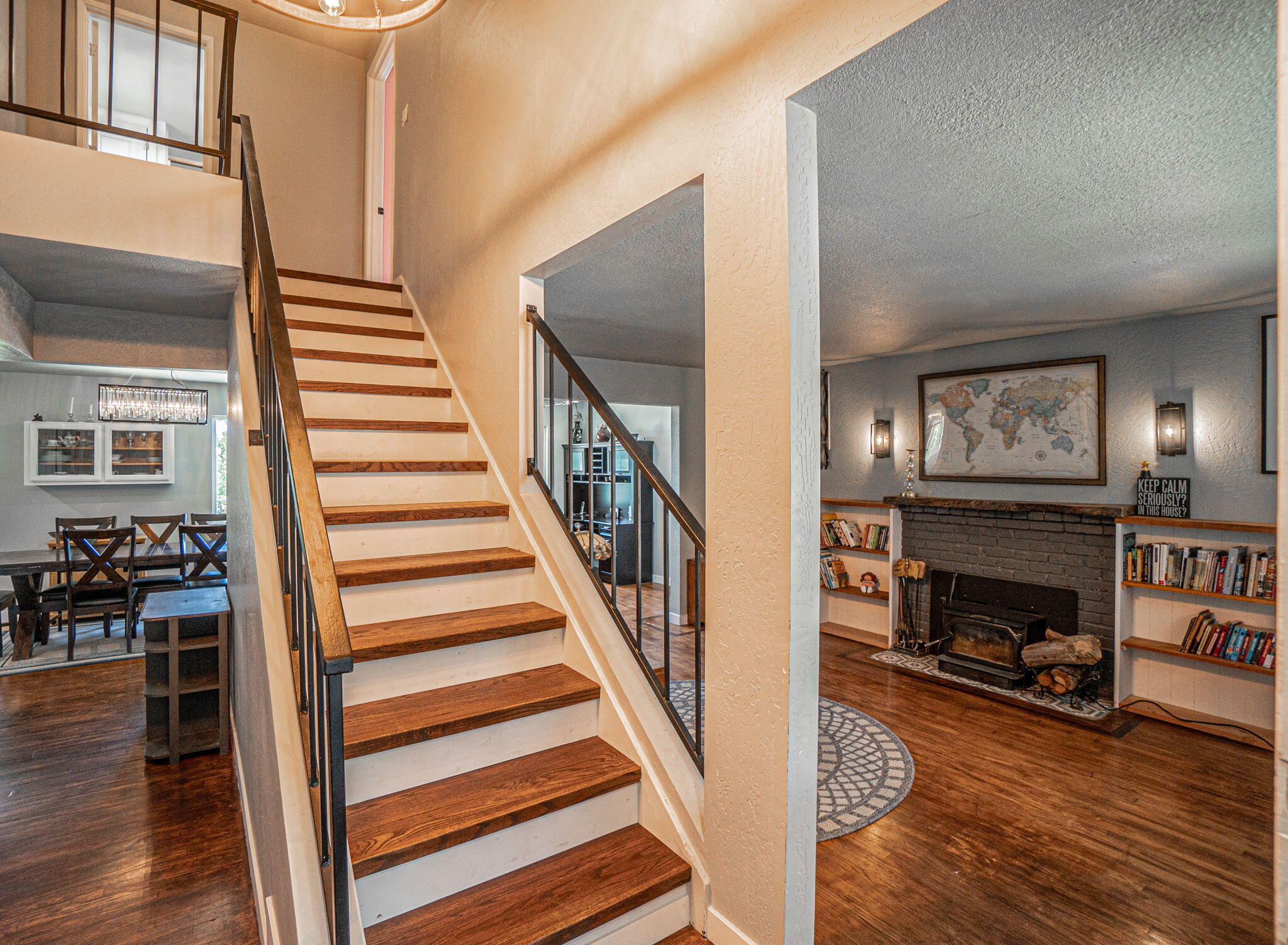 4970 Old Stage Road Central Point, OR 97502 - Photo 6 of 43 a view of a livingroom with wooden floor and a fireplace