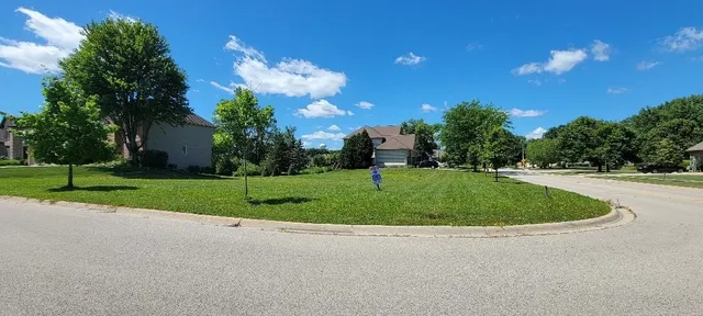 a view of a house with a big yard
