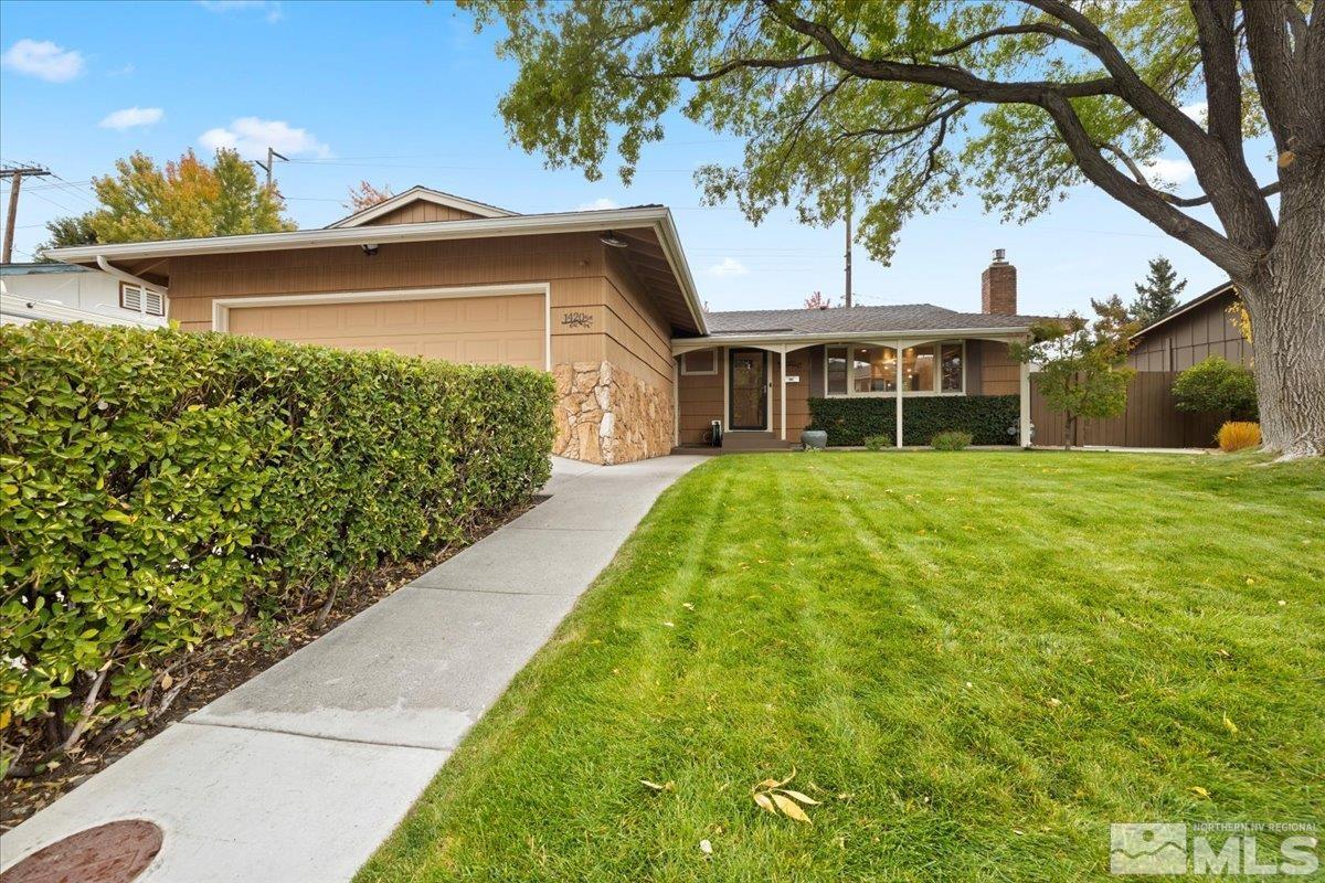 1420 Elizabeth Street Reno, NV 89509 - Photo 3 of 23 a view of a house with a small yard and large trees