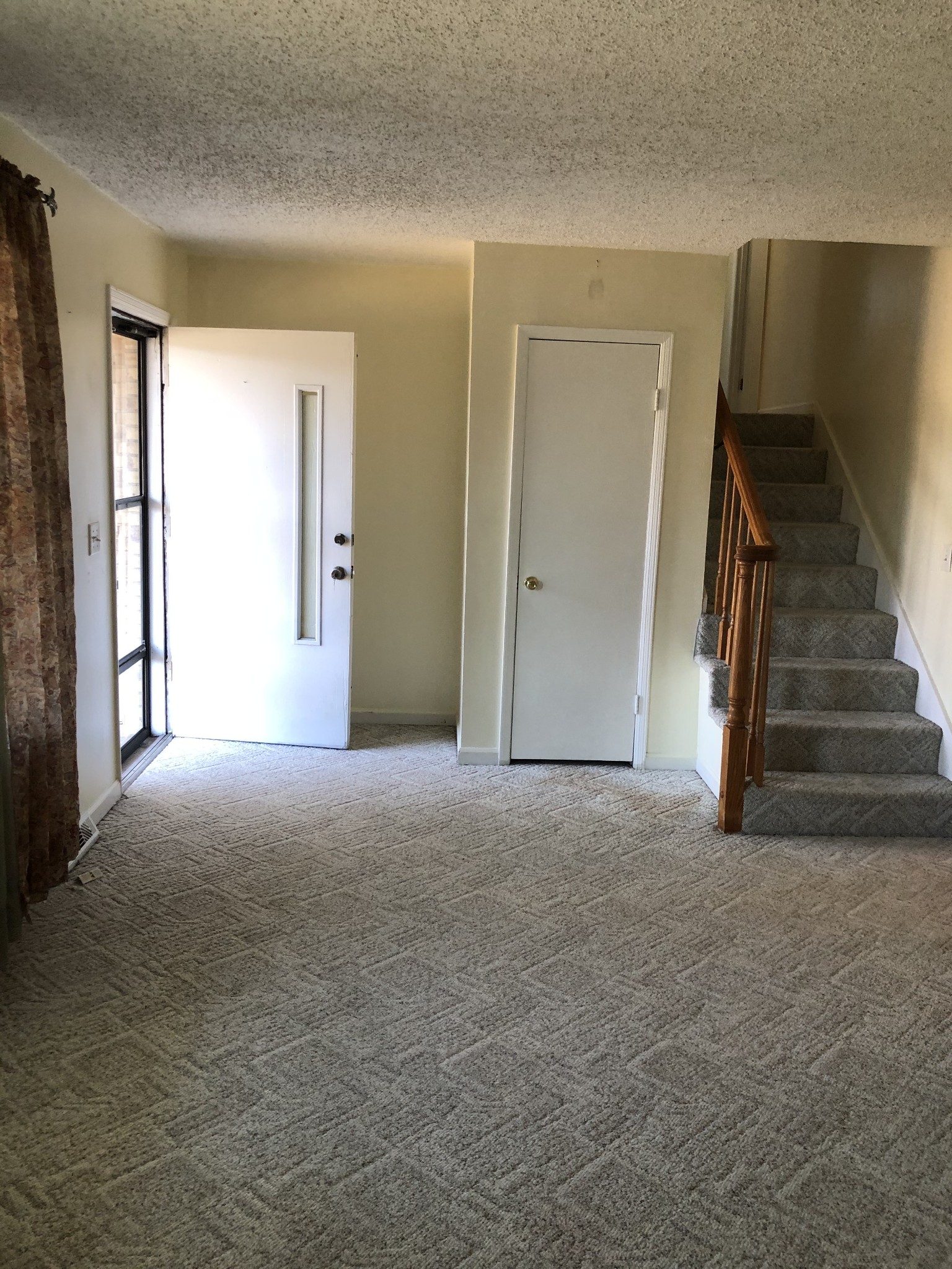 422 Cedarcliff Road Antioch, TN 37013 - Photo 5 of 26 a view of an empty room with stairs and a window