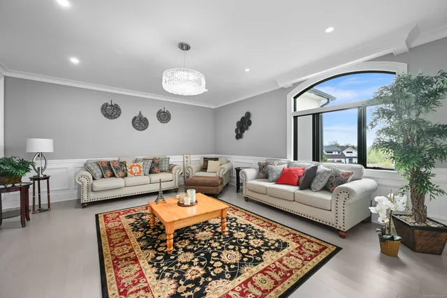 a living room with furniture and a rug