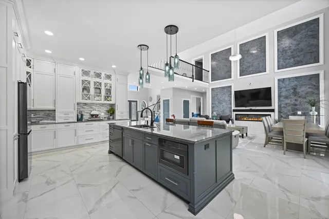 a kitchen with stainless steel appliances granite countertop a stove and a sink