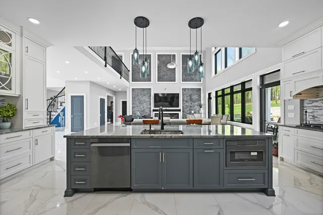 a kitchen with cabinets and window