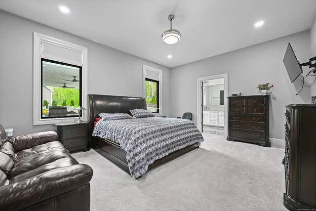 a bedroom with a bed and a couch