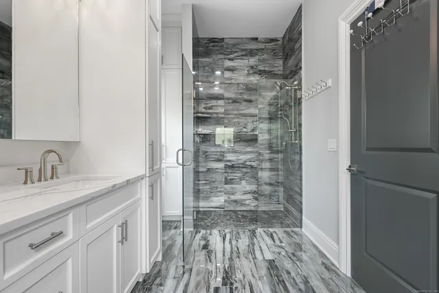 a bathroom with a sink and a mirror