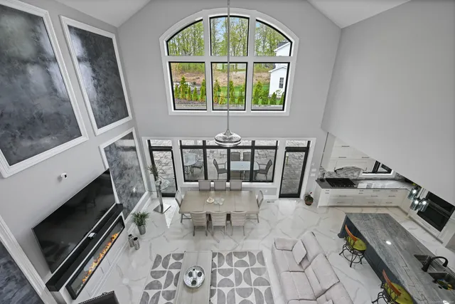 a view of a dining room with furniture and a window