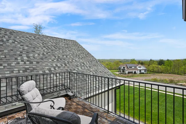 a view of a balcony with wooden floor