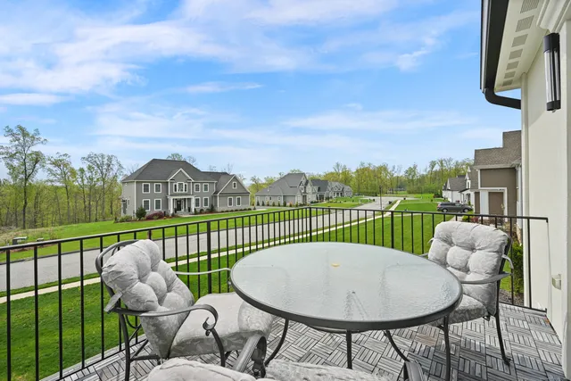 a view of a chairs and table in patio