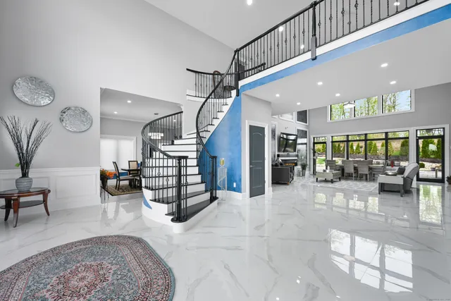 a living room with lots of furniture and a chandelier