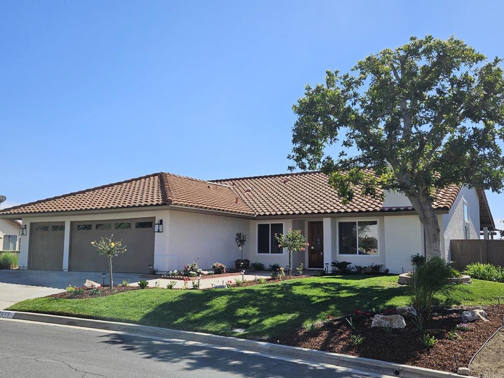 3915 Plateau Place Escondido, CA 92025 - Photo 1 of 1 a front view of a house with a garden