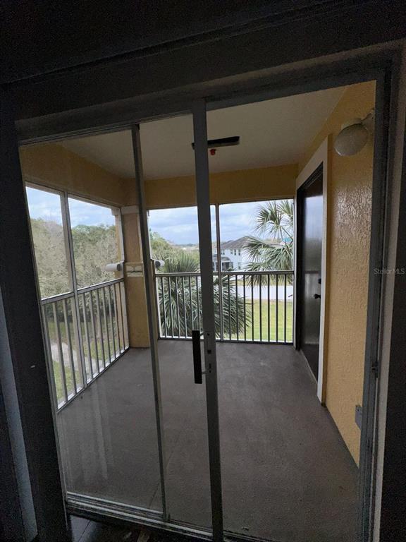 5459 Vineland Road, Unit 4310 Orlando, FL 32811 - Photo 12 of 12 a view of an empty room with a balcony
