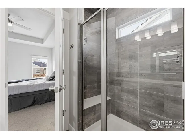 a bathroom with a shower and a sink