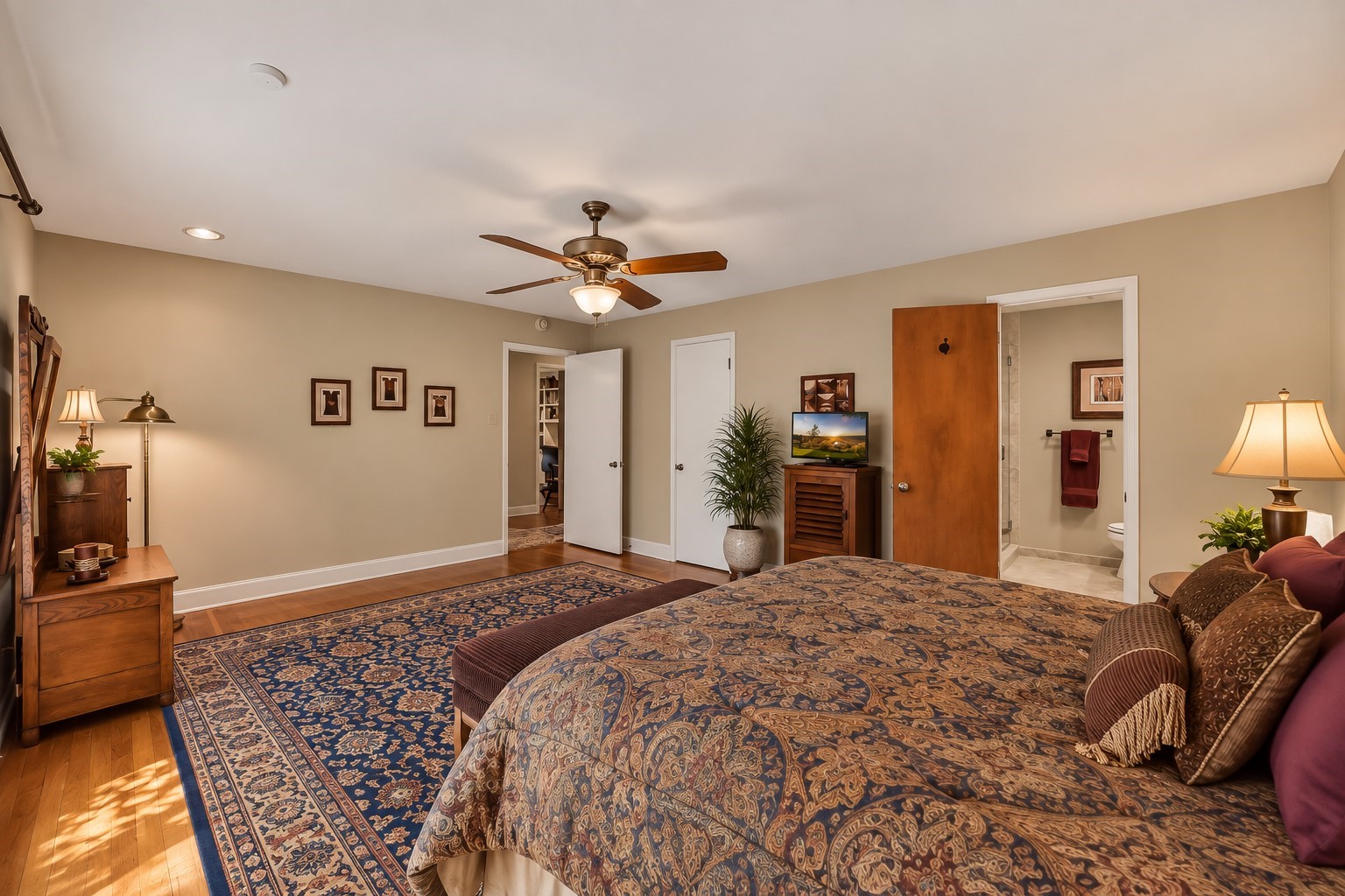 5626 Hummingbird Street Houston, TX 77096 - Photo 22 of 34 VIRTUALLY STAGED. The view of this guest suite bedroom (former primary suite) looking back to the hallway. The generous walk-in closet is just to the right of the hall entrance. There is then entrance into the bath area. There is plenty of room here for an added sitting area, desk area, or large television.