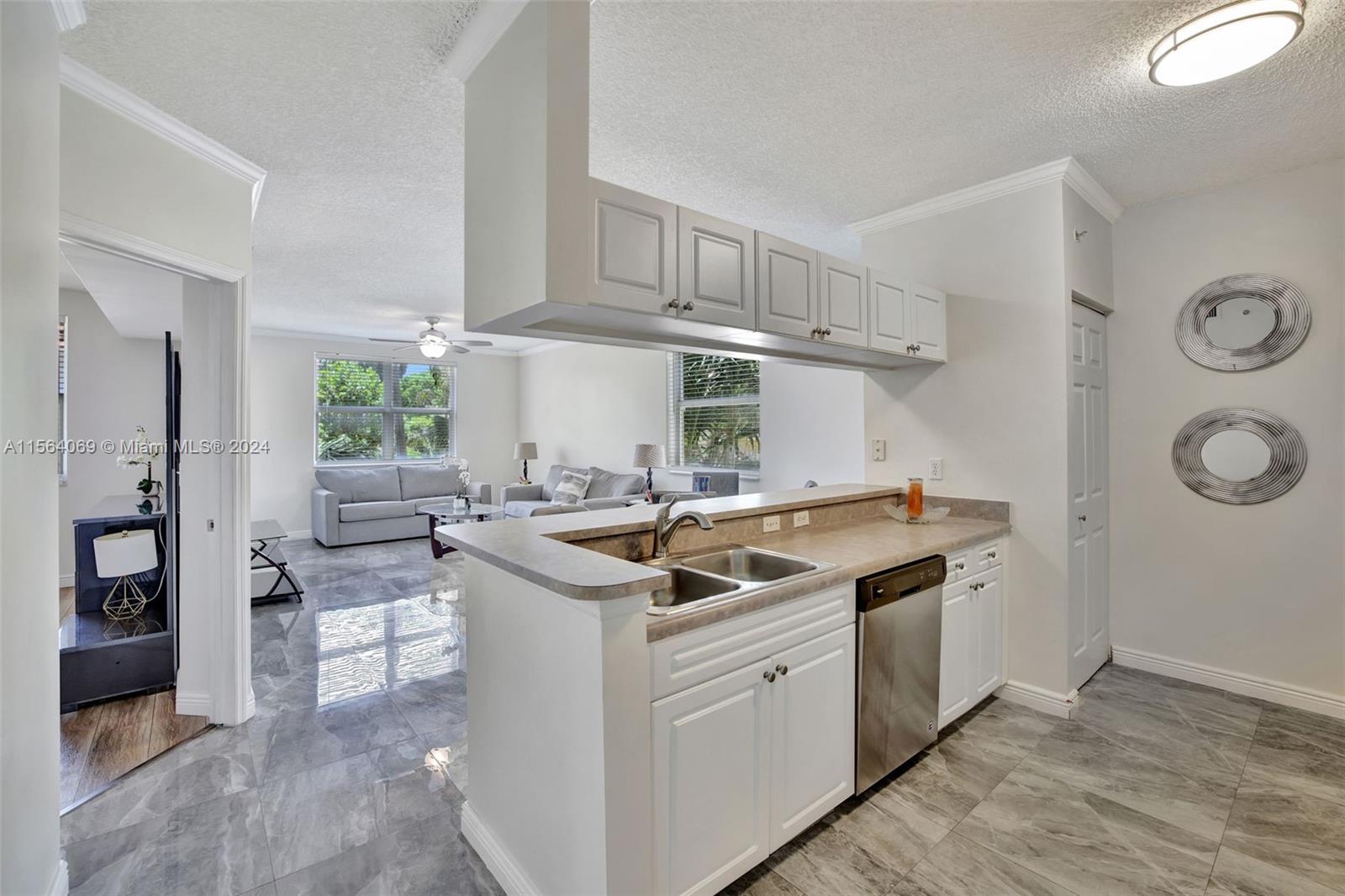 17150 North Bay Road, Unit 2216 Sunny Isles Beach, FL 33160 - Photo 1 of 46 a kitchen with stainless steel appliances granite countertop a sink and a stove