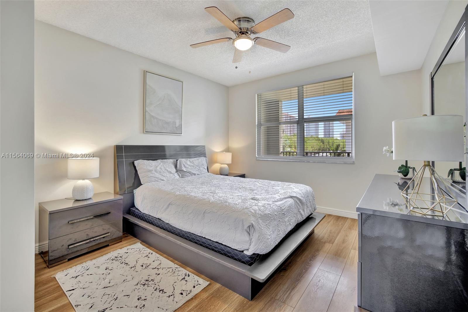17150 North Bay Road, Unit 2216 Sunny Isles Beach, FL 33160 - Photo 19 of 46 a bedroom with a bed and window