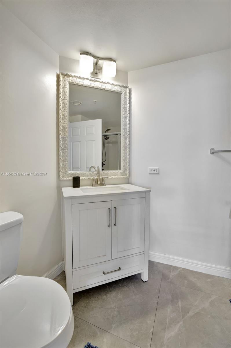 17150 North Bay Road, Unit 2216 Sunny Isles Beach, FL 33160 - Photo 23 of 46 a bathroom with a sink vanity and mirror
