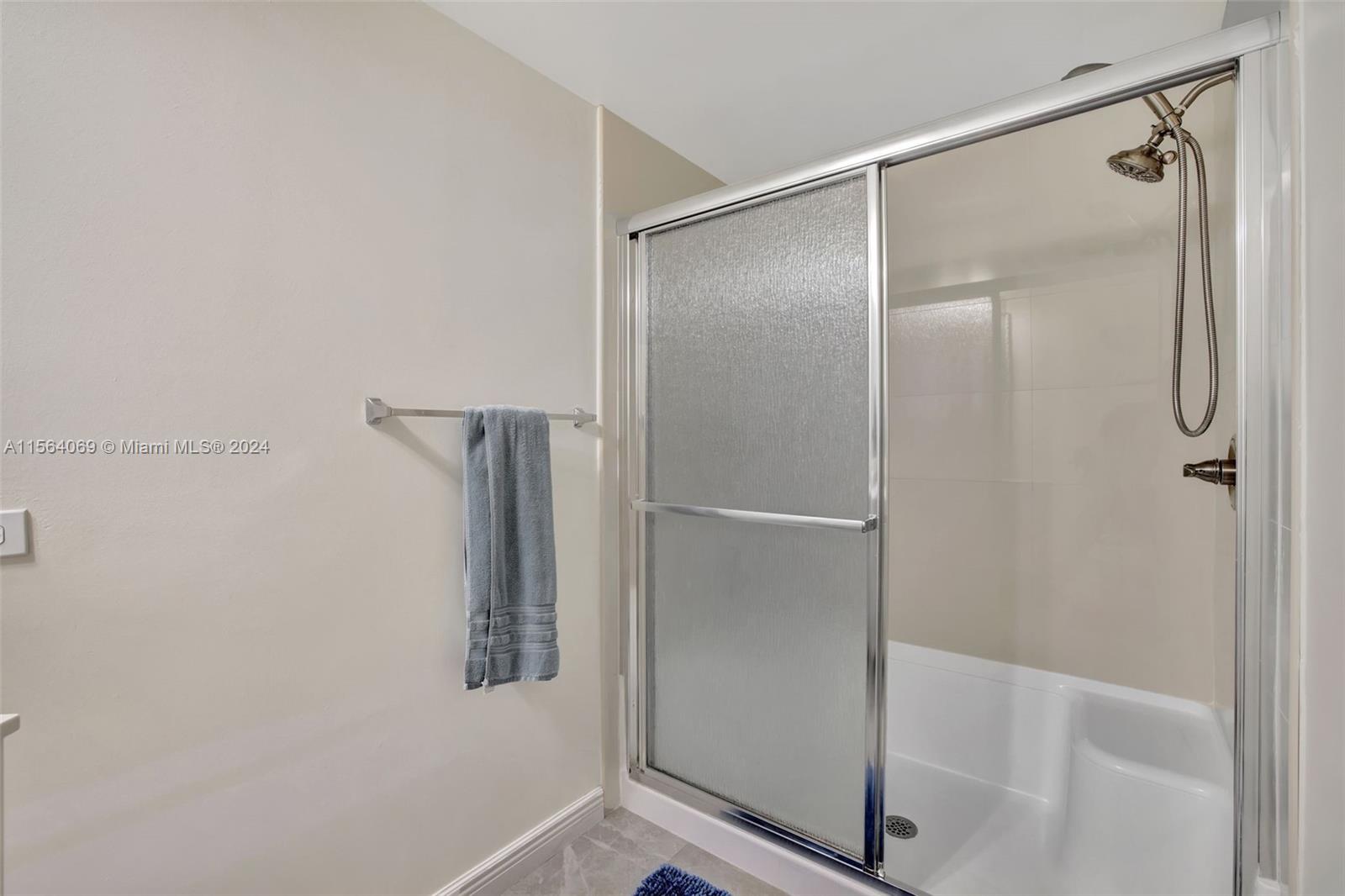 17150 North Bay Road, Unit 2216 Sunny Isles Beach, FL 33160 - Photo 24 of 46 a bathroom with a glass shower door