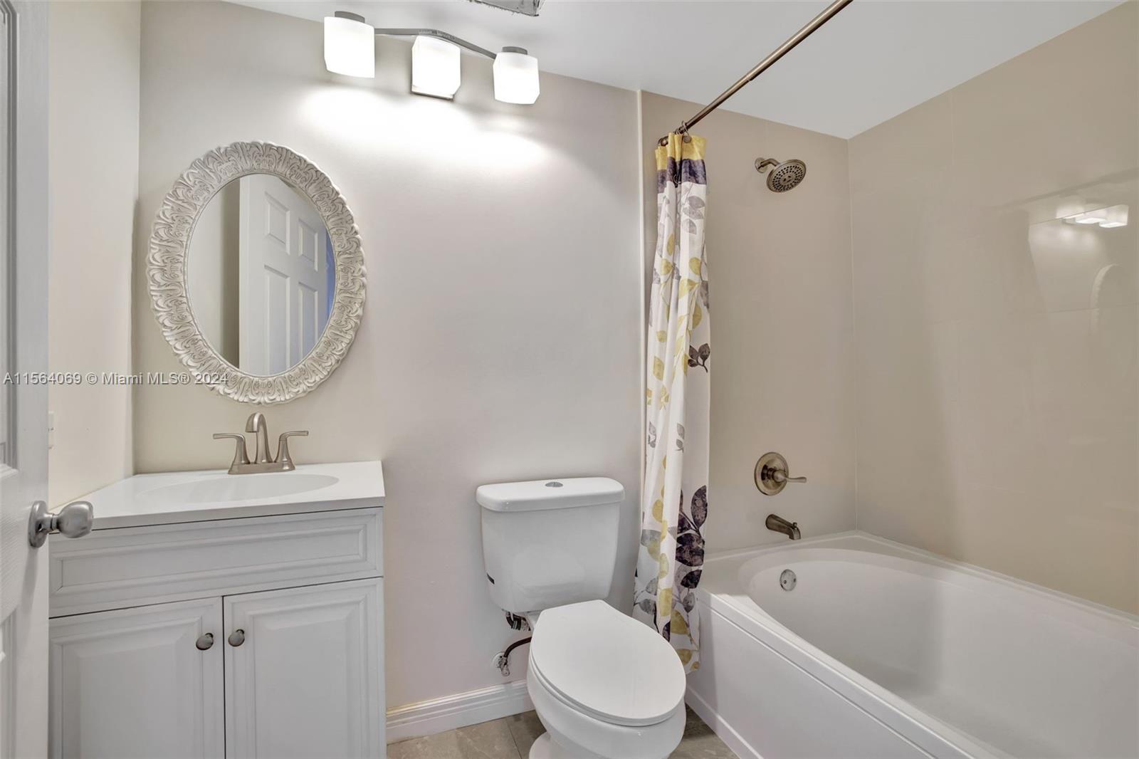 17150 North Bay Road, Unit 2216 Sunny Isles Beach, FL 33160 - Photo 30 of 46 a bathroom with a sink toilet and shower