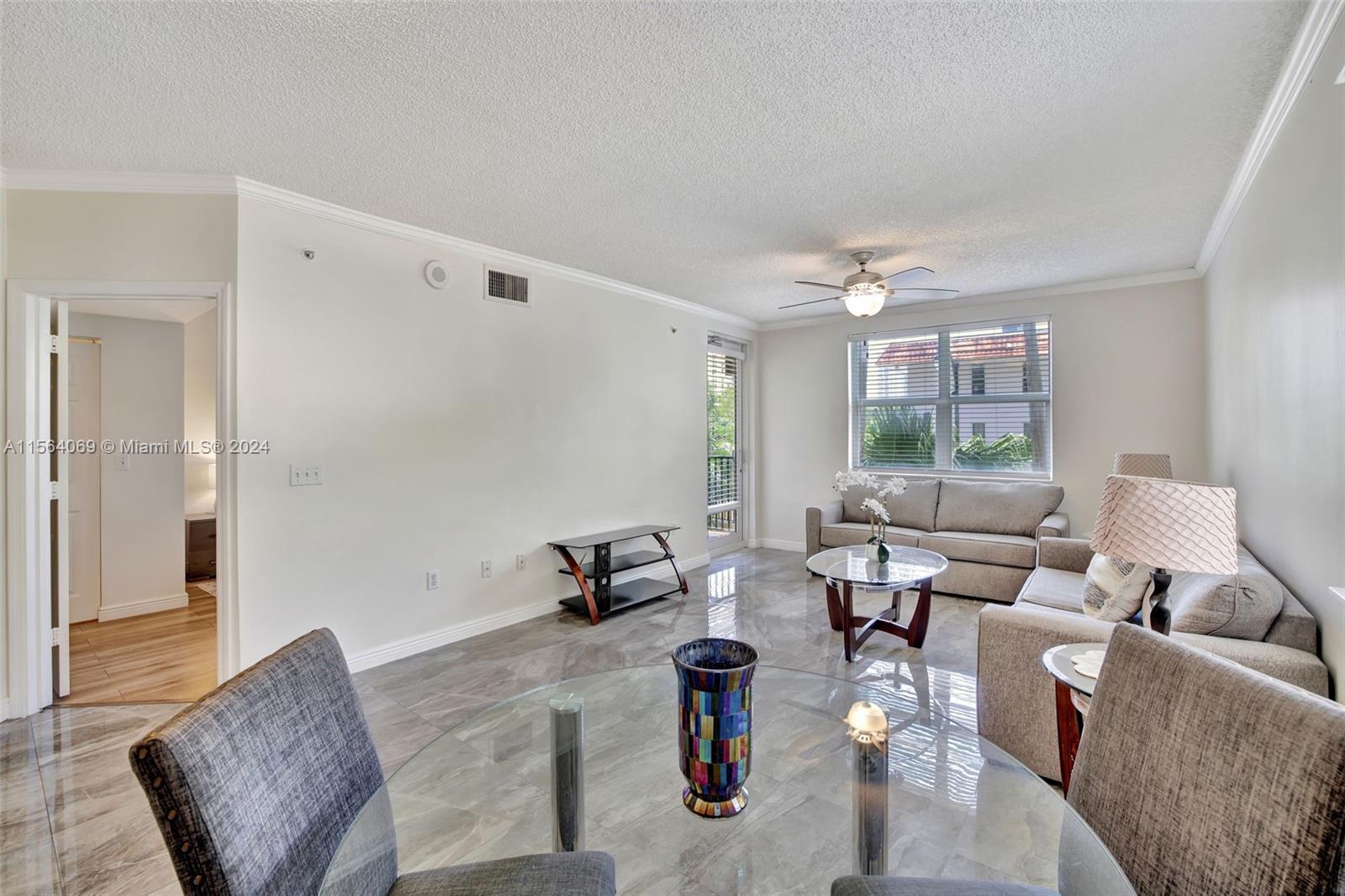 17150 North Bay Road, Unit 2216 Sunny Isles Beach, FL 33160 - Photo 3 of 46 a living room with furniture and a large window