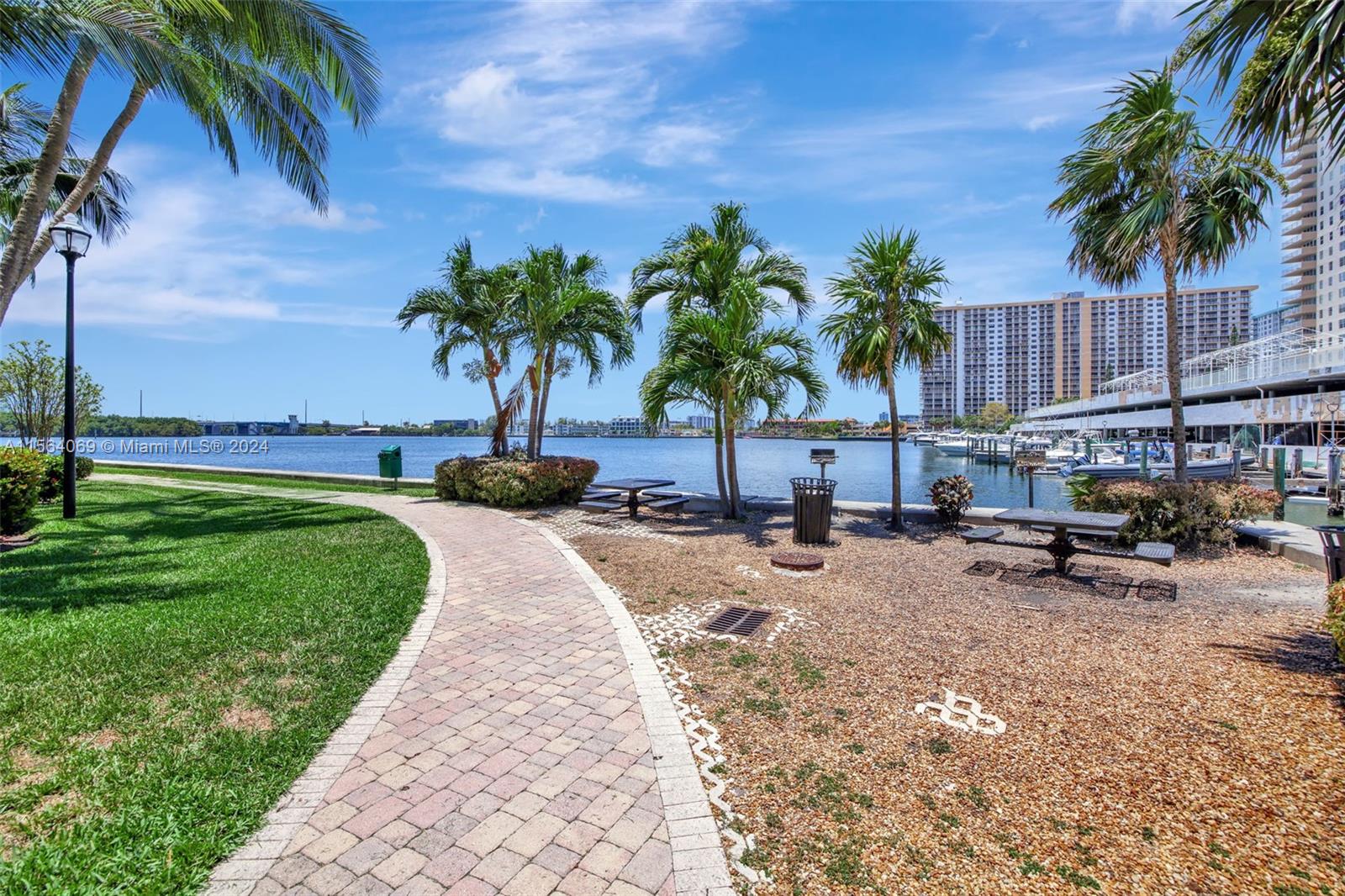 17150 North Bay Road, Unit 2216 Sunny Isles Beach, FL 33160 - Photo 35 of 46 a view of a backyard with a car parked