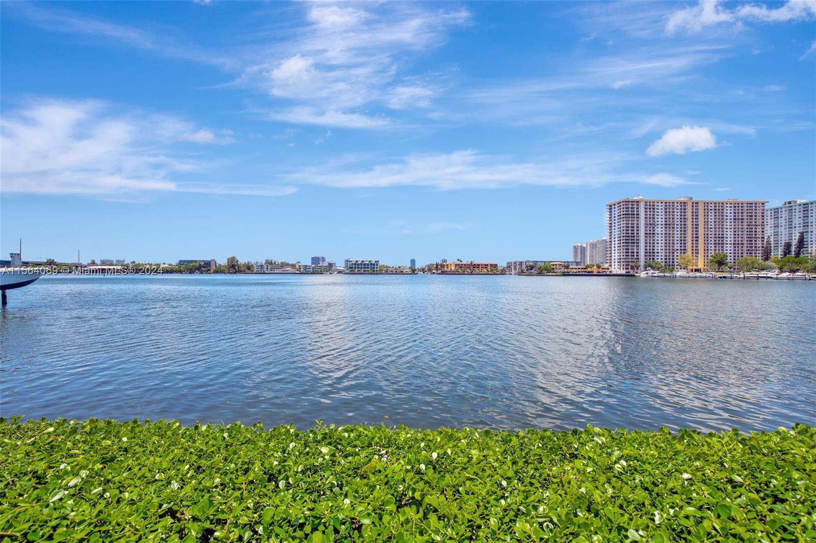 17150 North Bay Road, Unit 2216 Sunny Isles Beach, FL 33160 - Photo 37 of 46 a view of a lake from a yard