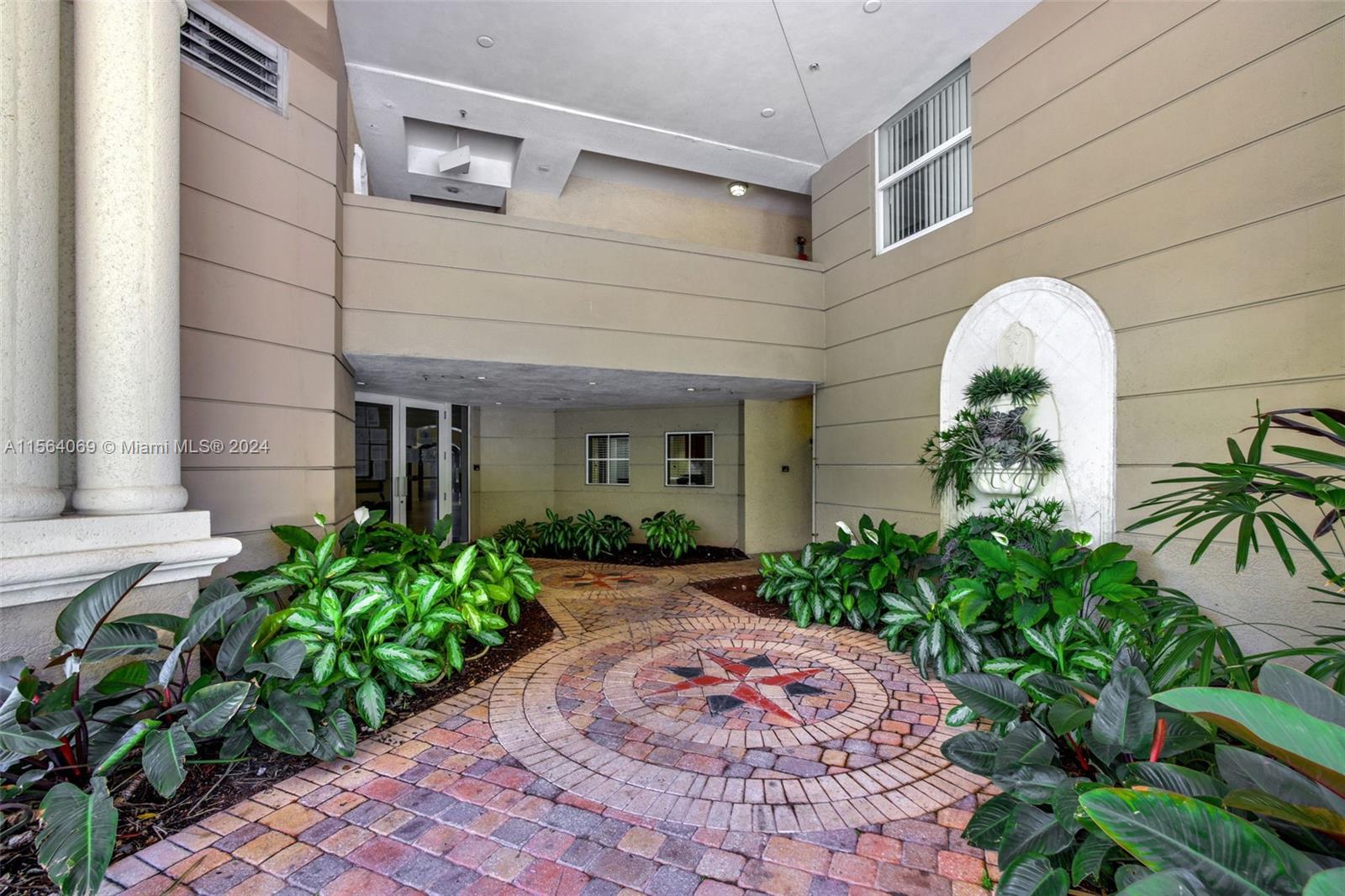 17150 North Bay Road, Unit 2216 Sunny Isles Beach, FL 33160 - Photo 43 of 46 a front view of a house with garden
