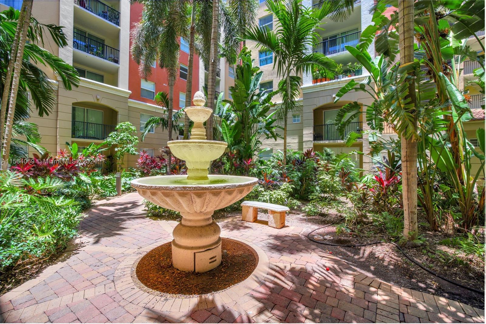17150 North Bay Road, Unit 2216 Sunny Isles Beach, FL 33160 - Photo 44 of 46 a view of a fountain in the backyard of a house